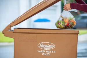 Throwing-Away-Food-Waste-In-Brown-Yard-Waste-Cart-EJ-Harrison-Industries-Trash-Hauler-Ventura-County