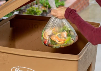 Throwing-Away-Food-Waste-in-Brown-Yard-Waste-Cart-Vertical-EJ-Harrison-Industries-Trash-Hauler-Ventura-County-1