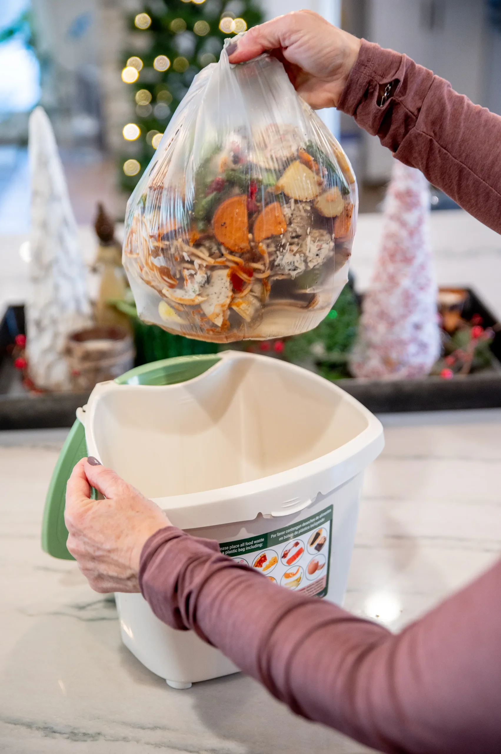 Greener Holiday Food-Waste-Taking-Bag-out-of-bucket